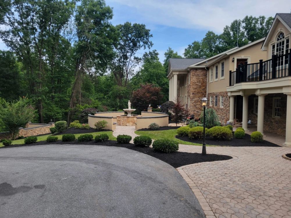 Paver courtyard with fountain built by Green Diamond Landscaping